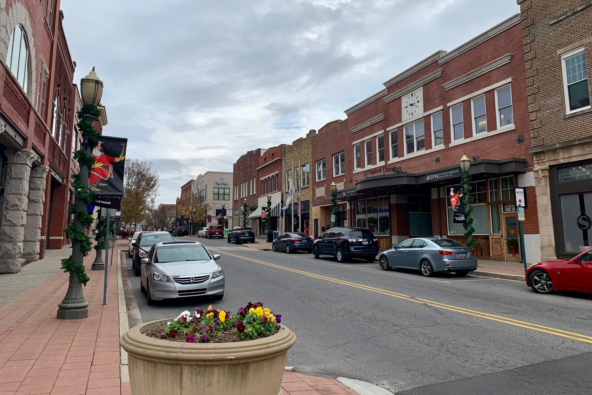 Main Street, downtown Rock Hill, SC: brick storefronts, holiday garland, street planter